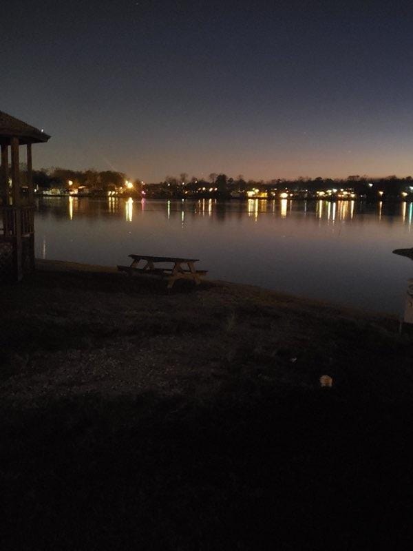 Peaceful nighttime view of Lake Conroe from Venice On The Lake