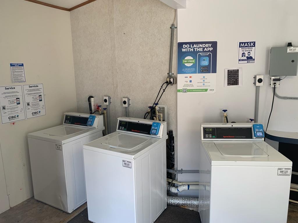 Commercial washers in the laundry room at Venice On The Lake