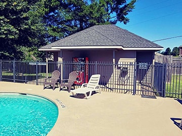 Pool with cabana and lounge chairs at Venice On The Lake
